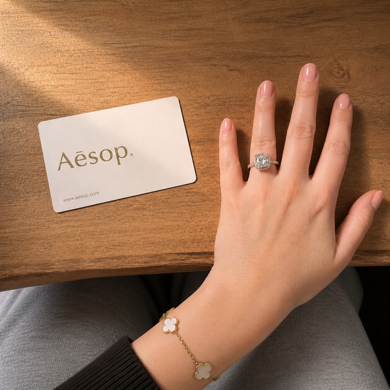 Client's hand laid flat next to a reference card.